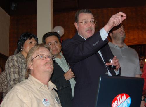 Jeff Rogers (right) reacts to the first round of election results.